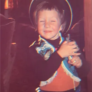 Mike King at a young age, dressed like a cowboy.